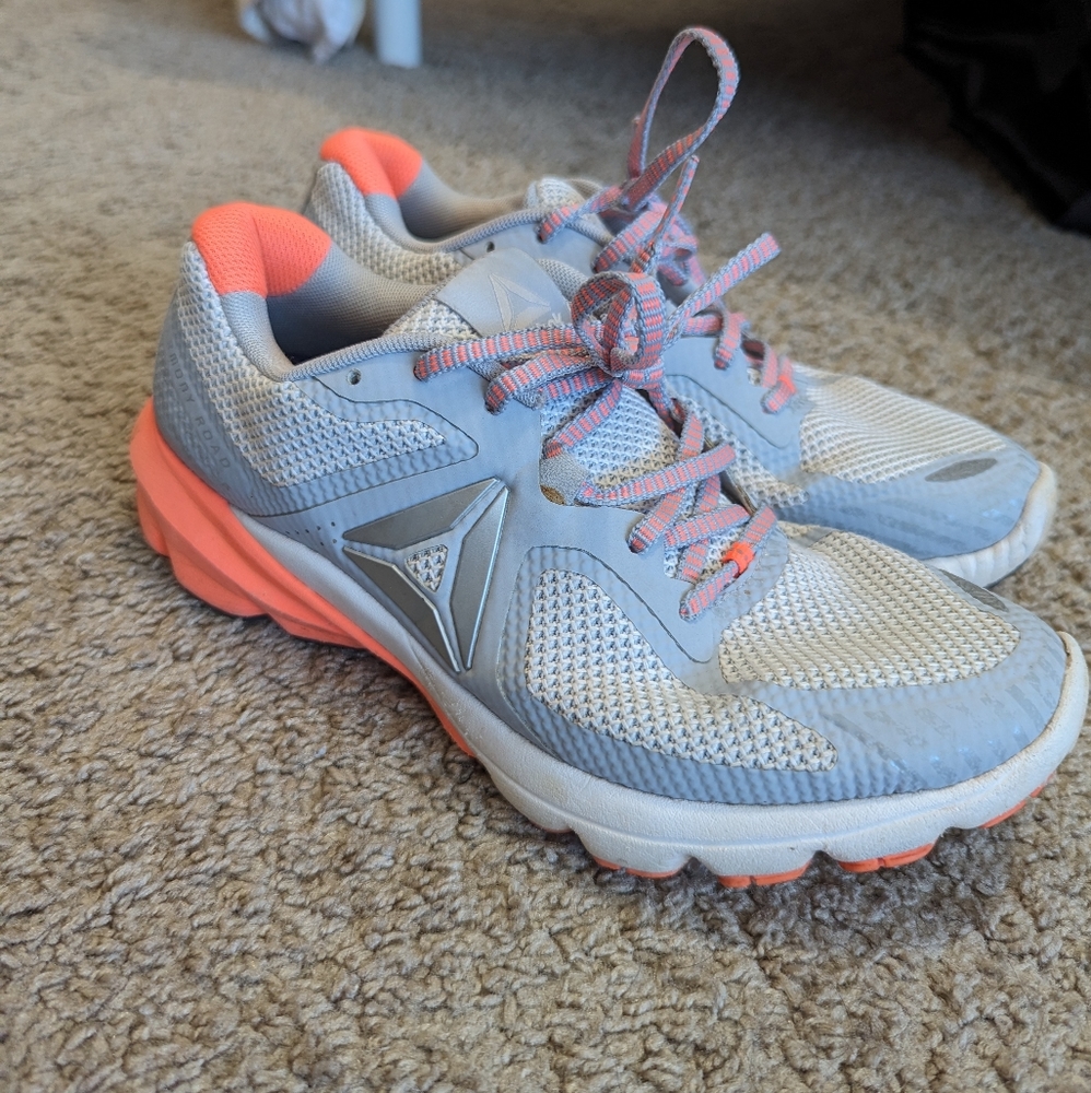 Orange and gray Reebok gym shoes